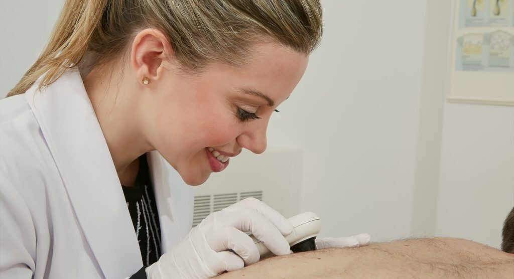 Dr. Bailey performing minor surgery under local anesthesia